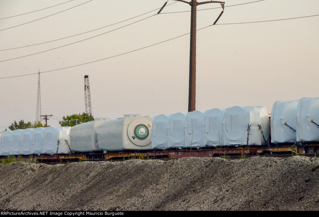 QTTX & KRL Flat cars with load in the yard